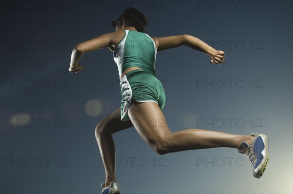 African American female athlete running