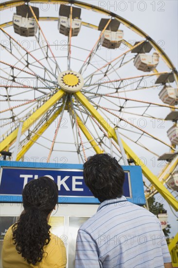 Mixed Race teenaged couple at carnival