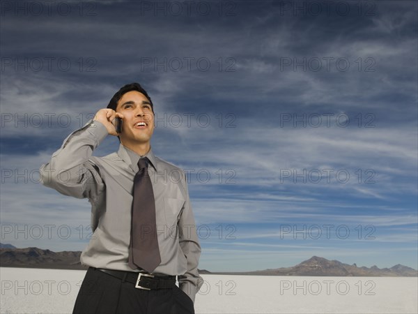 Hispanic businessman talking on cell phone