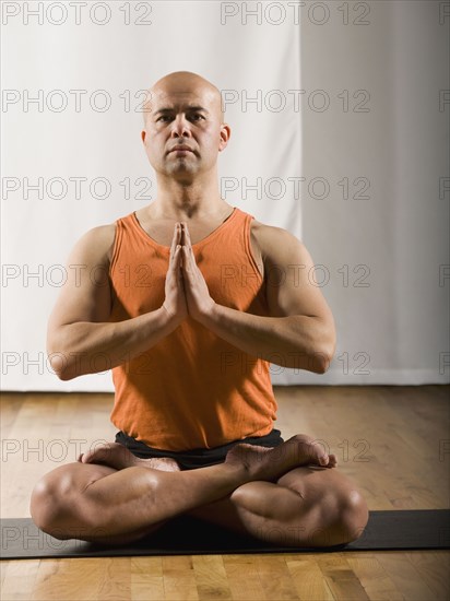 Hispanic man practicing yoga