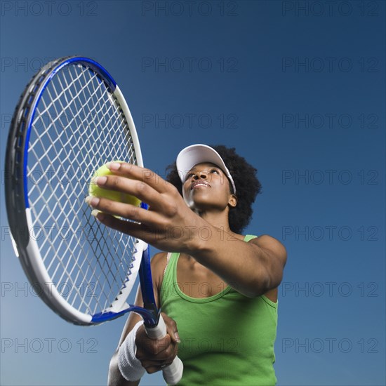 African woman playing tennis