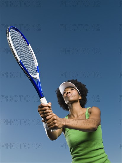 African woman playing tennis