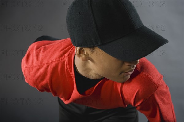 Mixed race baseball pitcher