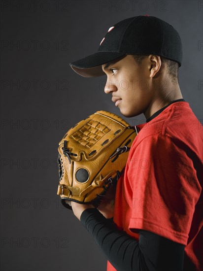 Mixed race baseball player looking serious