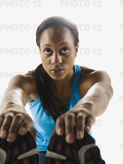 Mixed race runner stretching