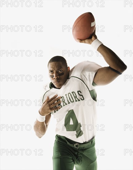 African quarterback throwing football