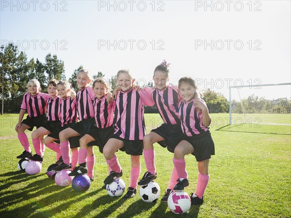 Girl soccer players standing in a row