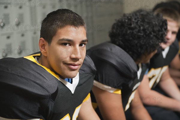 Football players dressing in locker room