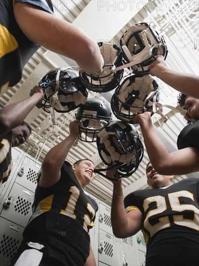 Football players celebrating in locker room