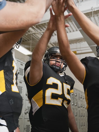 Football players celebrating in locker room