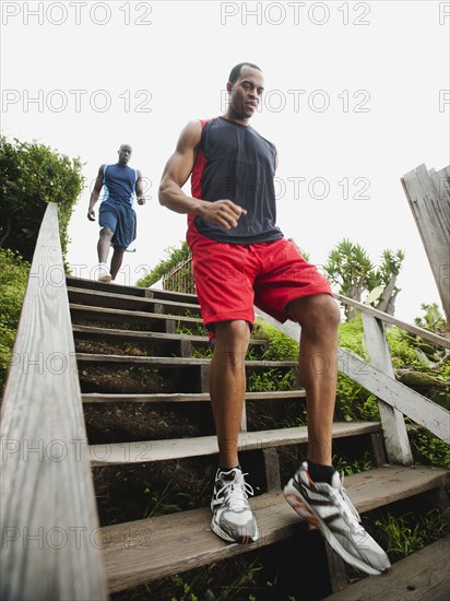 Men running down stairs for exercise