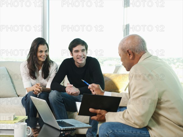 Couple talking to financial advisor