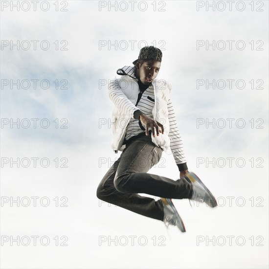 African American jumping in mid-air