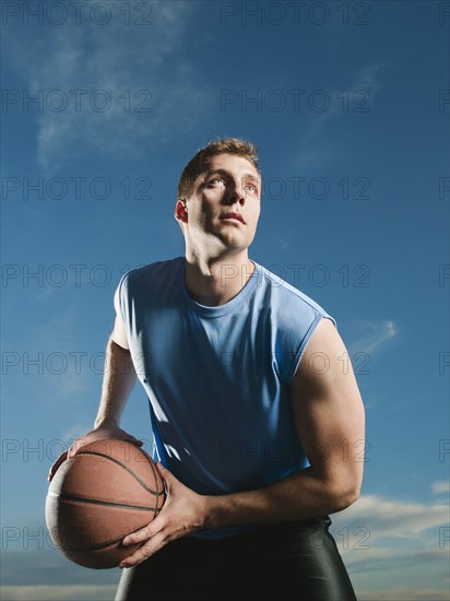 Caucasian man playing basketball