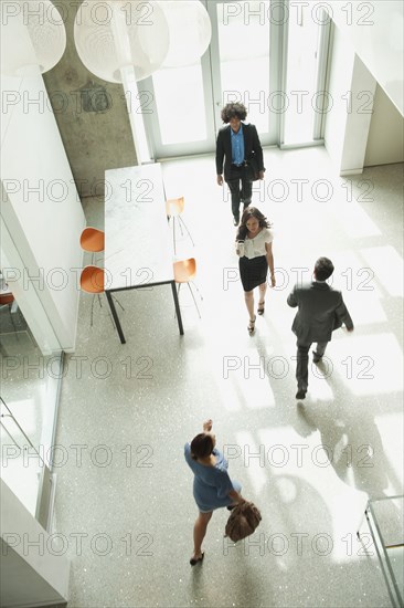 Business people walking in office