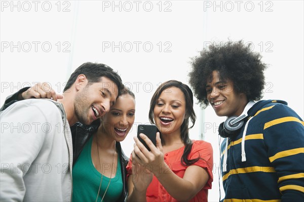 Friends looking at cell phone