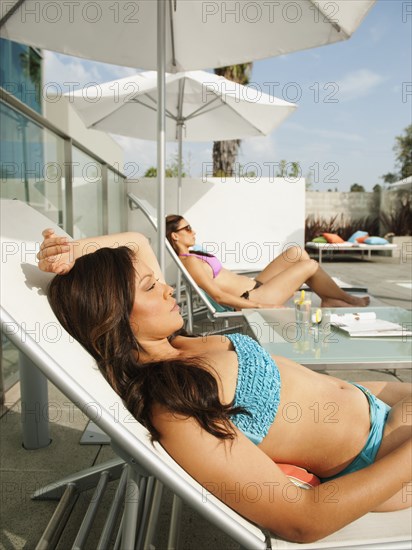 Friends sunbathing together