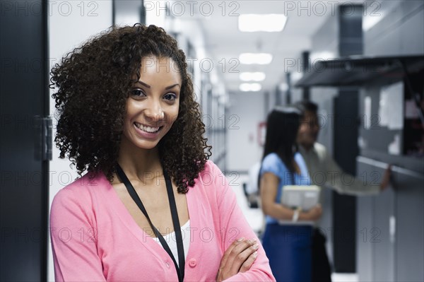 Black businesswoman standing in server room