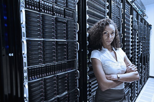 Black businesswoman standing in server room