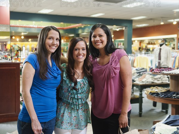 Friends shopping in clothing store