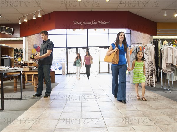 People shopping in clothing store