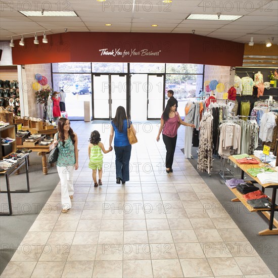 People shopping in clothing store