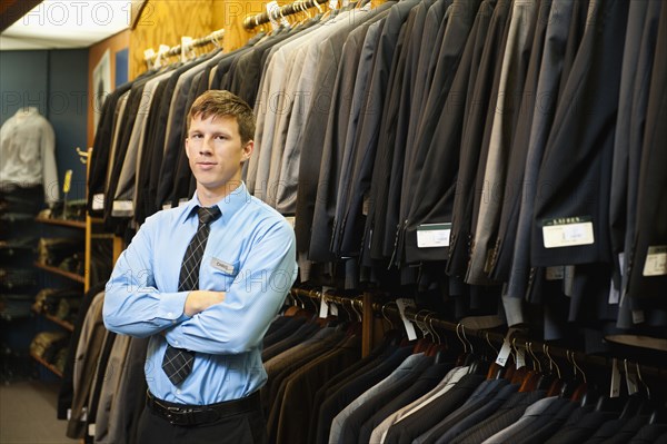 Caucasian man working in men's clothing store