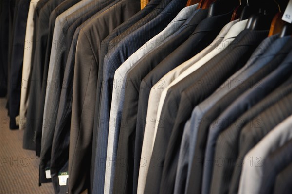 Men's suit jackets in clothing store