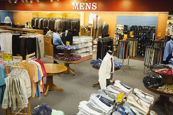 Caucasian man working in men's clothing store