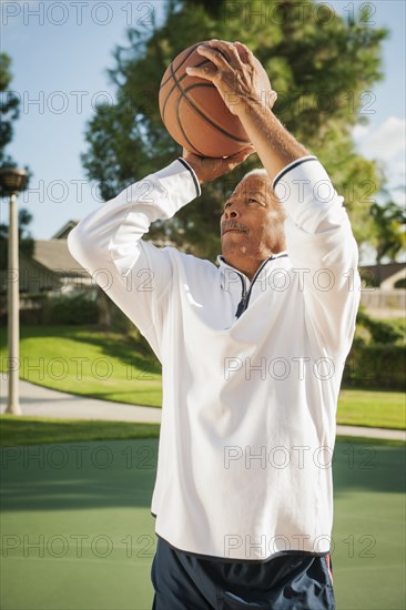 Black man playing basketball