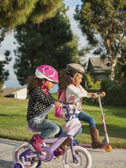 Mixed race girls playing outdoors