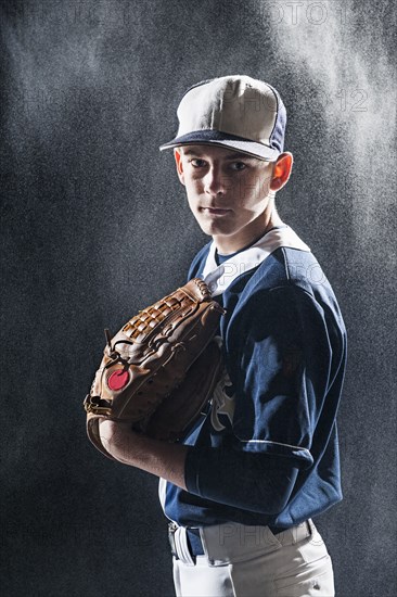 Caucasian baseball player standing under lights