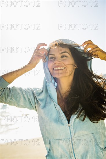 Mixed race woman wearing hoodie outdoors