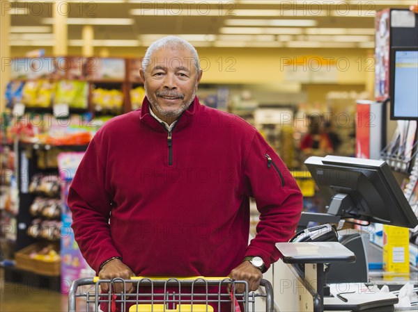 African American customer at grocery store checkout