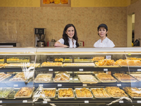 Businesswoman and chef at restaurant counter