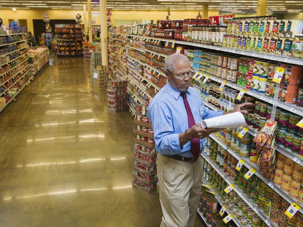 African American businessman working in grocery store