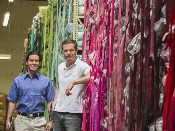 Workers smiling in textile factory