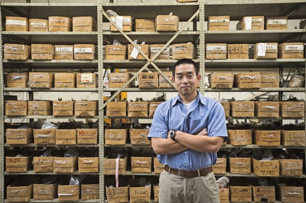 Chinese worker smiling in textile factory