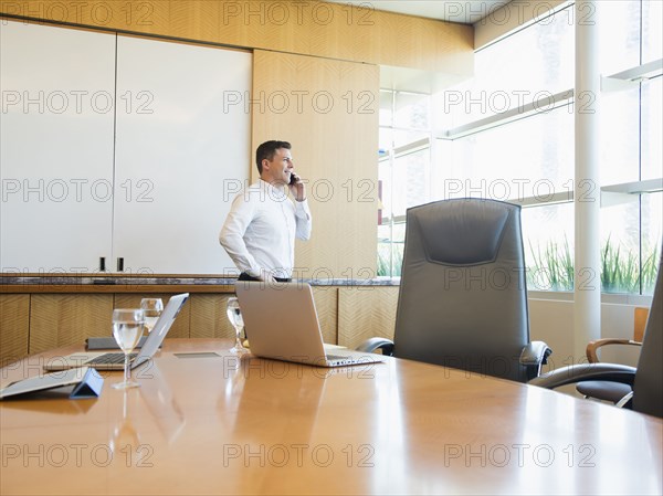 Caucasian businessman talking on cell phone