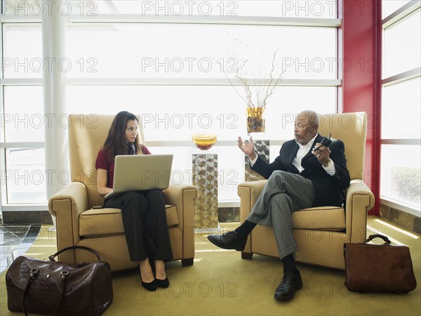 Business people talking in lobby area