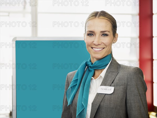 Caucasian hostess smiling