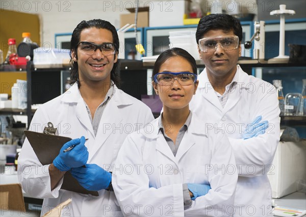Scientists smiling in laboratory