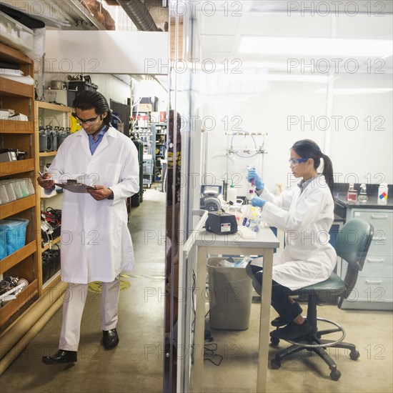 Scientists working in laboratory