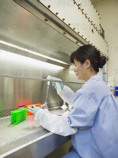 Vietnamese scientist working in laboratory