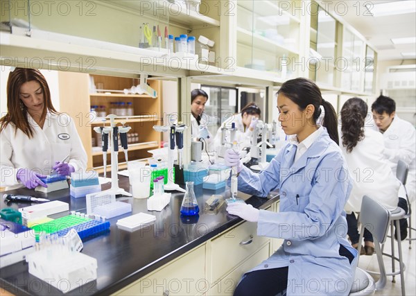 Scientists working in laboratory