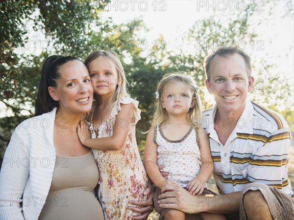 Family smiling together outdoors