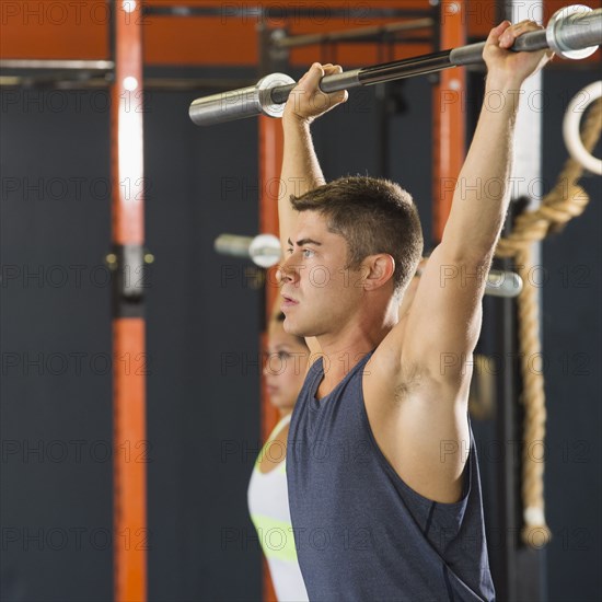 Caucasian man working out in gym