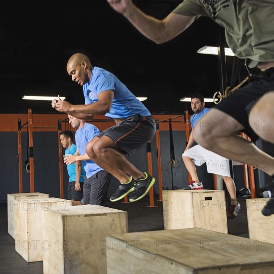 Men training together in gym