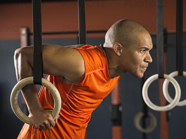 Black man working out in gym