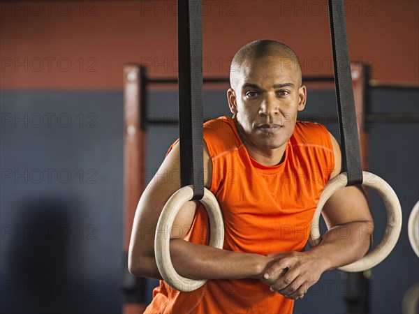 Black man resting in gym